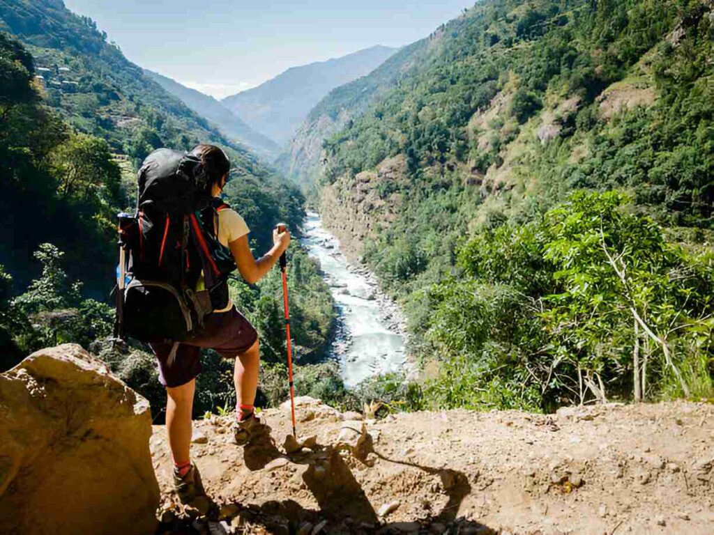 man trekking in autumn season in mountain