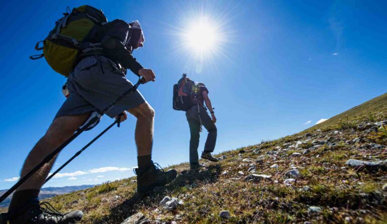 two men walking high hill for the trekking in nepal